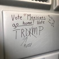 Graffiti that says Vote Mexicans go home, Vote Trump