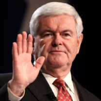 Older white haired man making a face and holding his hand up facing out in front of his face