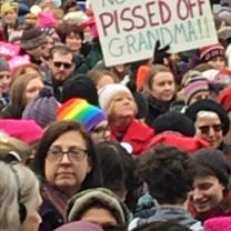 A crowd of mostly women and a sign reading Pissed Off Grandma!