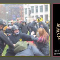 Proud Boy getting ready to punch a woman a a protest