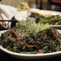 The “Good Good Salad” (front center), grilled vegetables (background) 