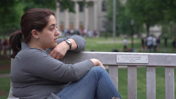 Photo from Hunting Ground - girl sitting alone and sad on porch