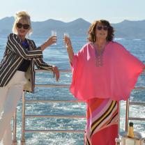 Two women drinking on a boat