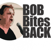 White middle aged man with black hair yelling into a microphone and words Bob Bites Back