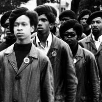 Black Panthers in berets in black and white photo