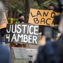 Protestors holding signs