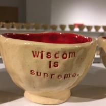 Coffee mug that says Wisdom is something