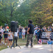 Speakers and crowd by gazebo