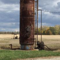 Tall metal structure out in a field - an injection well