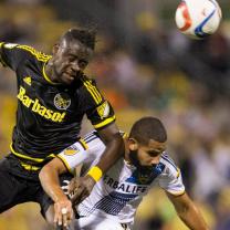 Kei Kamara (left) battles for a header against LA Galaxy defender Leonardo. (Photo courtesy of Crew SC)