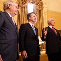 Three white guys in suits looking important