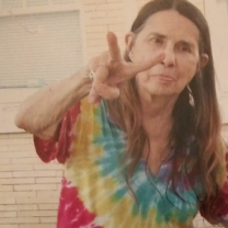 Margaret Sarber making a peace sign