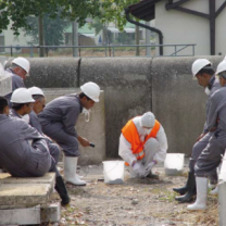 Men in hazard suits working