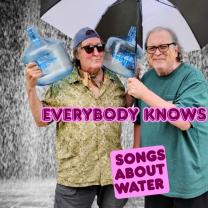 Bob and Dan with an umbrella and water bottles